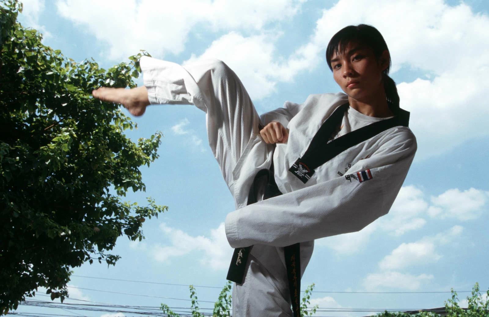 Thai Olympic hopeful Yaowapa Boorapolchai, 19, is a leading Taekwondo athlete. Trained by a South Korean coach, Yaowapa’s supporters say she is a candidate for gold medal in the Olympics in Athens, Greece. Photo and story credits to Yvan Cohen.