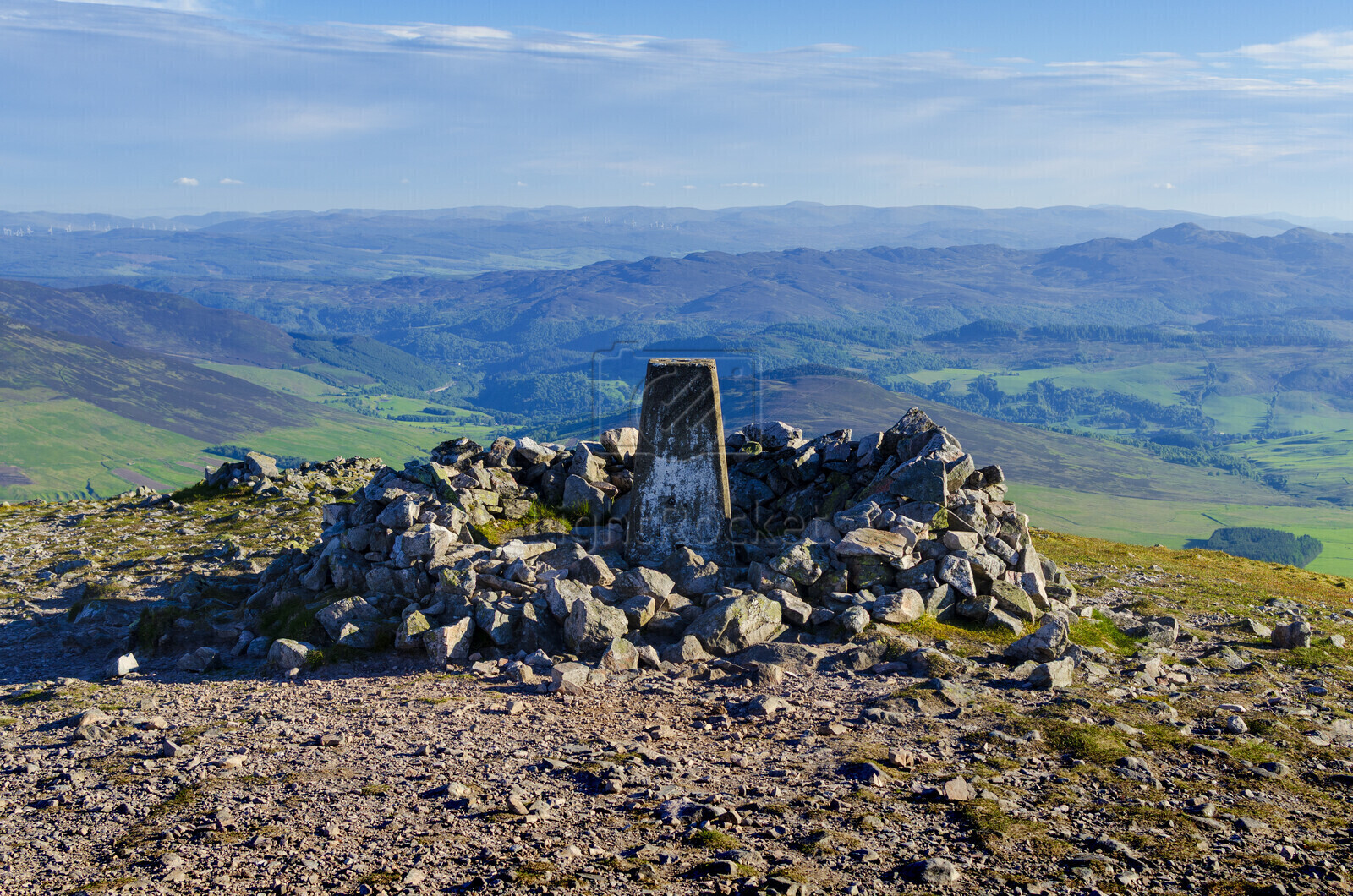 The geographical trig point on the summit of the peak of Carn Liath on the left in the Cairngorms National Park near Blair Atholl, Perthshire in the Scottish Highlands of Scotland UK