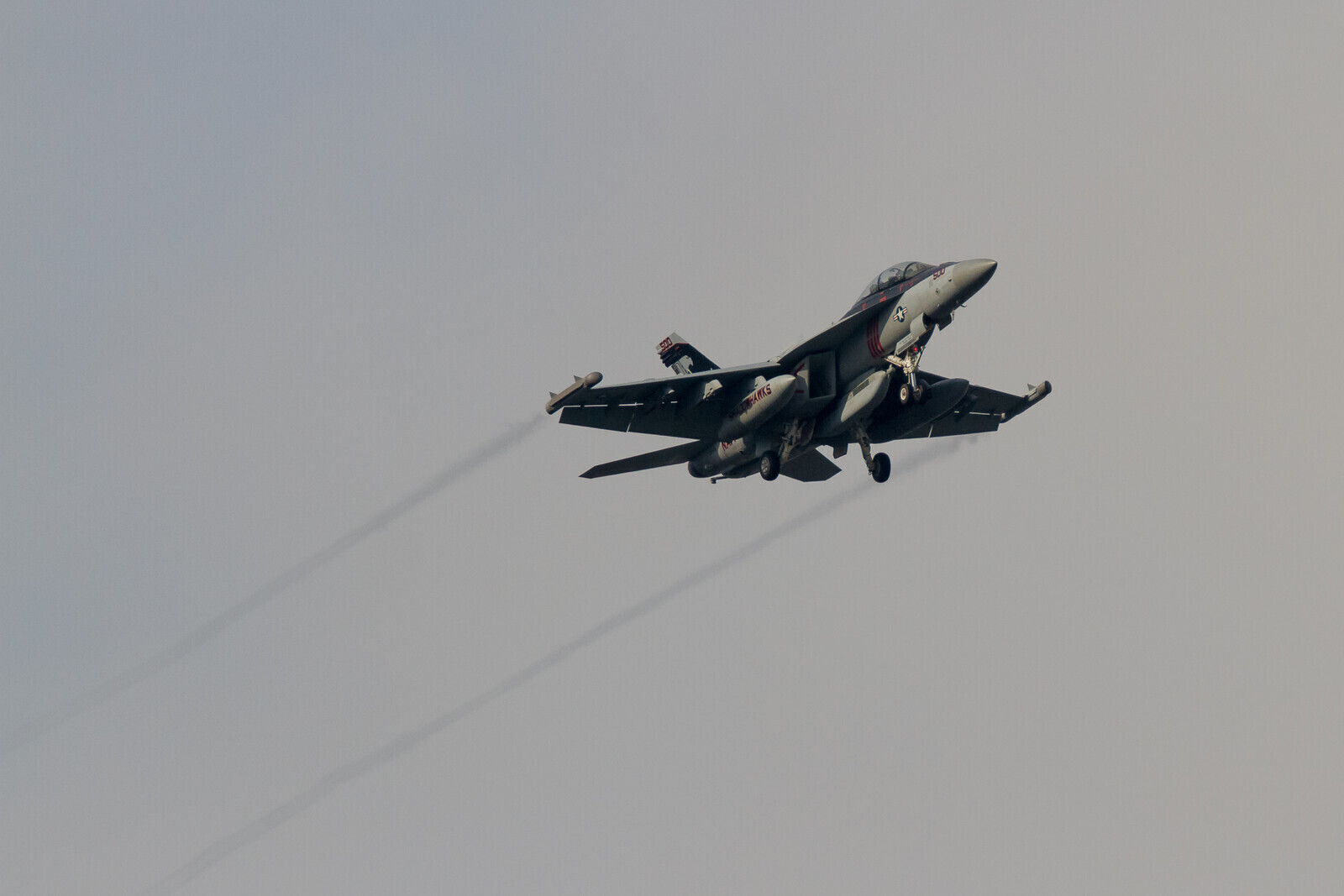 A Boeing EA-18G Growler jet fighter with the VAQ-141, US Navy Electronic Attack Squadron known as the Shadowhawks  flying near NAF, Atsugi airbase, Kanagawa, Japan. Tuesday May 31st 2016.