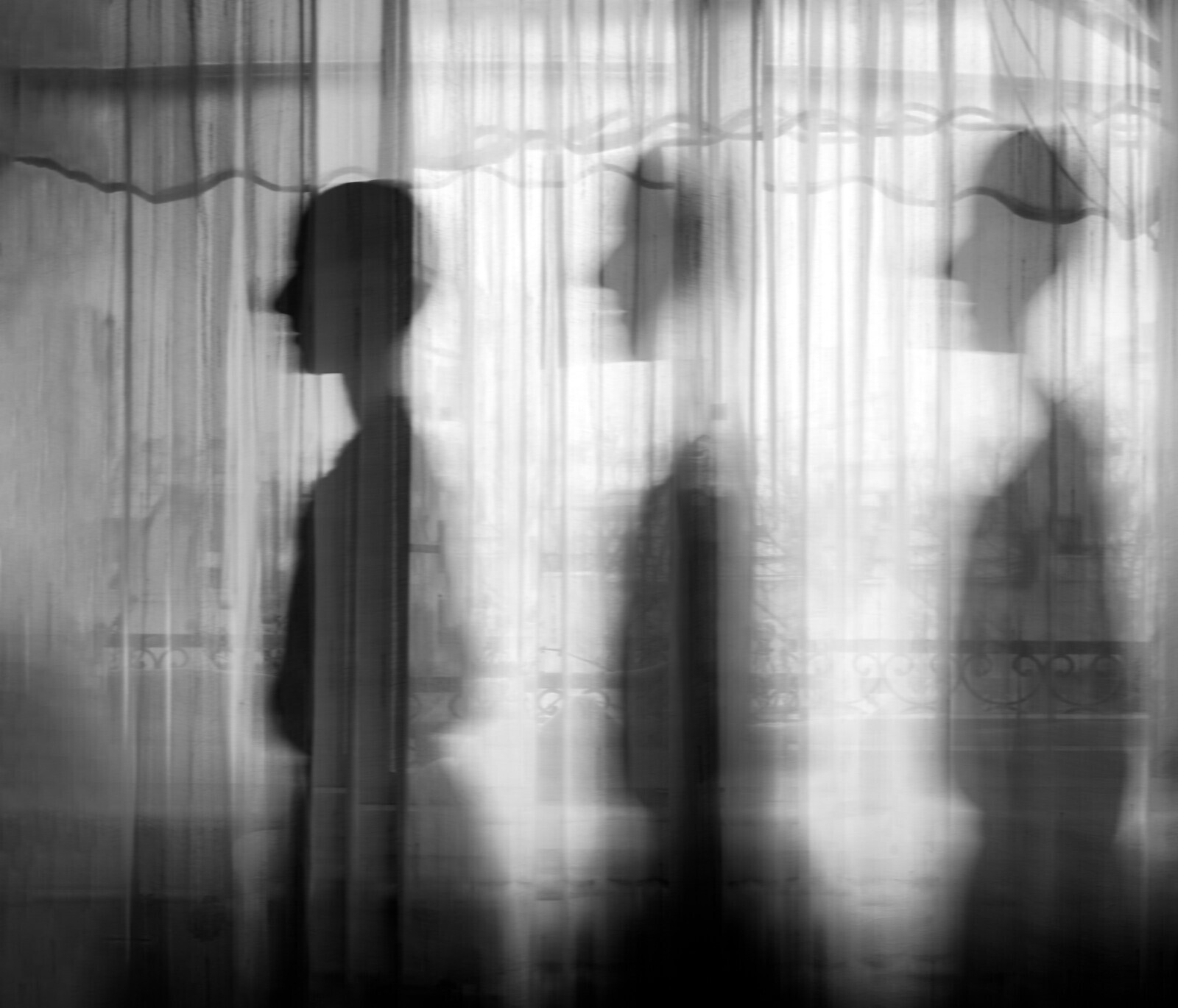Fading, Belgrade, Serbia, 2022.  
The same window in most of the photographs, photographed by me in 2025, 2022 and 2021, but a totally different woman standing in front of it now. They say that the wounds are the places where the light comes in. So, I just embraced it. My photovoice journey started before the "Pink Frame" (Ružičasti kadar) research. As a photographer, I found joy and consolation in capturing precious moments even in the darkest period of my life - when I was undergoing chemotherapy. Photography helped me express my feelings and suppress my fears. With camera in my hands, I felt stronger - as if I was the one in control. This experience (terrible and enlightening st the same time) inspired me to facilitate a photovoice research with women who have also been diganosed with and recovering from breast cancer, like myself. Analyzing their photographs and naratives gave me the courage to share my personal story.