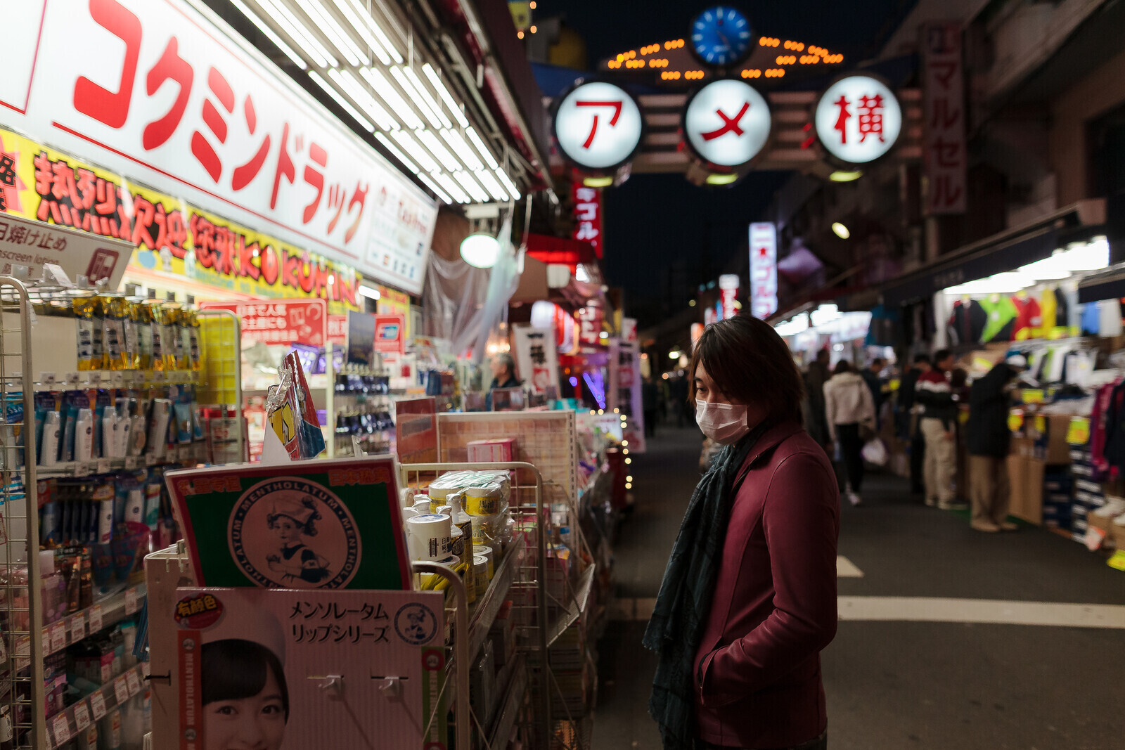 A man looks at goods on display outside a drug store in Ameyayokocho market Ueno, Tokyo, Japan Friday December 4th 2015
